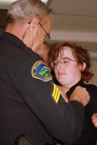 The police officer pinning on my badge is my father. We have always held a very special connection as both being ones in uniform.