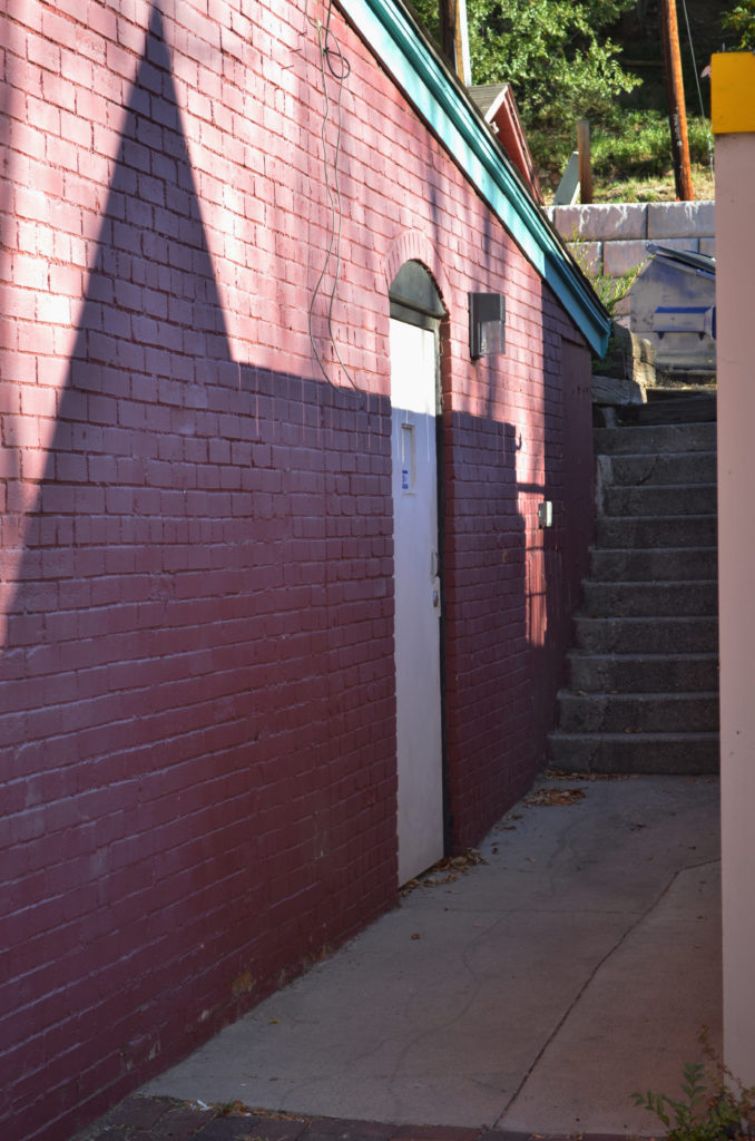 White door red brick wall FX